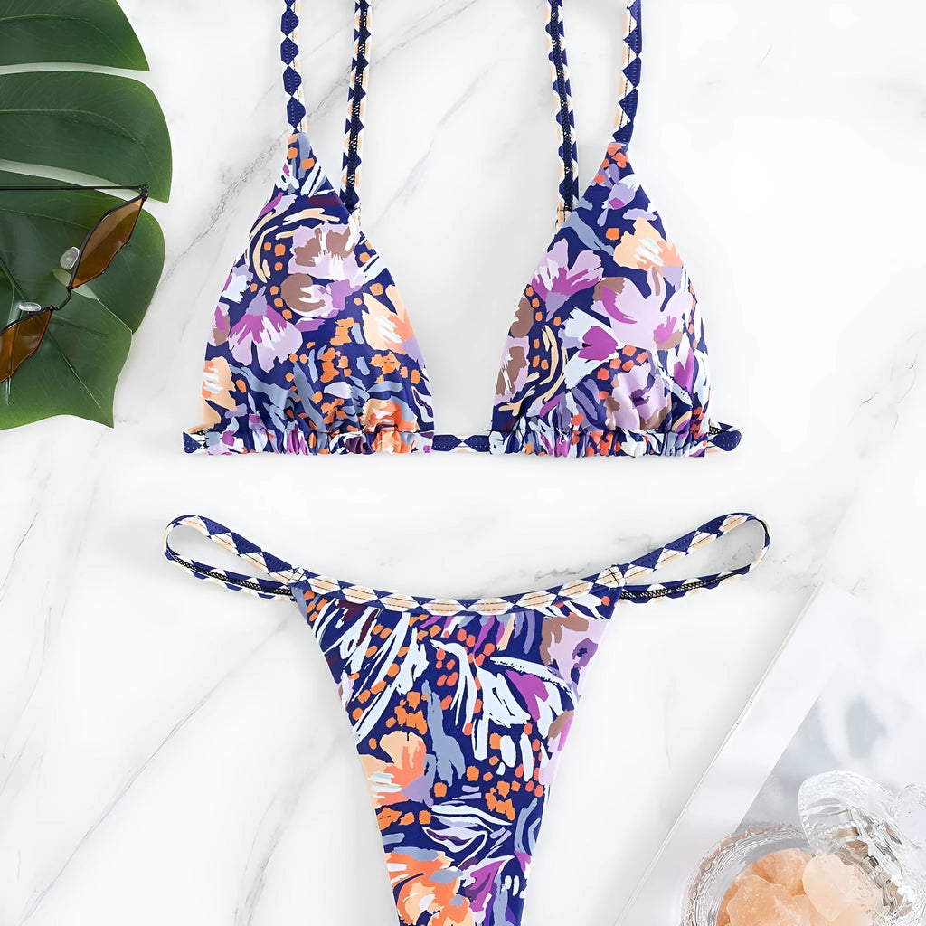 Women's floral print polyester swimsuit briefs on a white background.