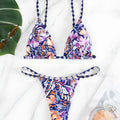 Women's floral print polyester swimsuit briefs on a white background.