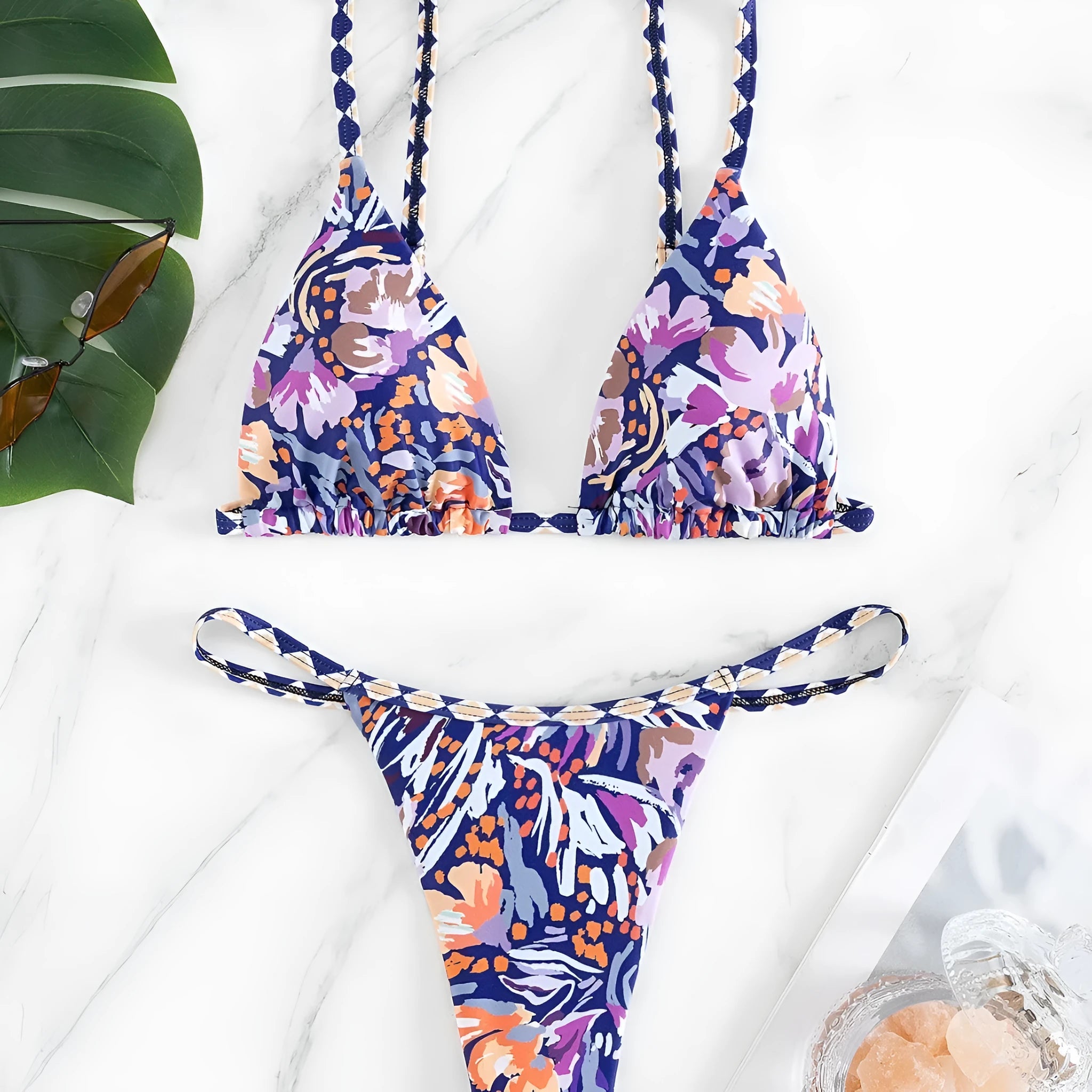 Women's floral print polyester swimsuit briefs on a white background.