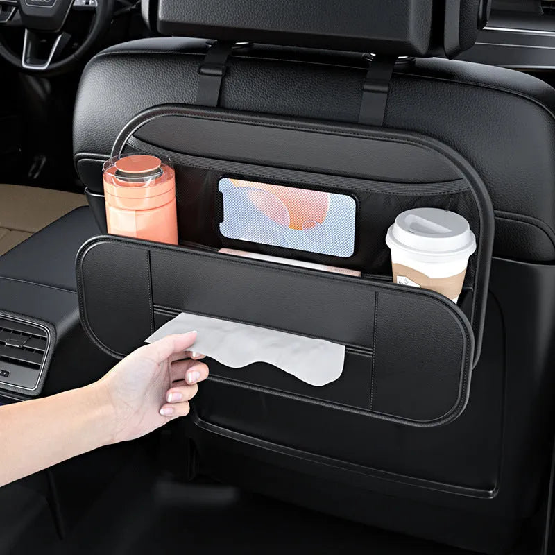 Black leather car seat rear storage bag measuring 36x24x8cm hanging on a vehicle seat back
