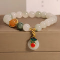 Women's ice jade crystal bracelet with xiangyun peace buckle and pearl accents on a retro-style chain.