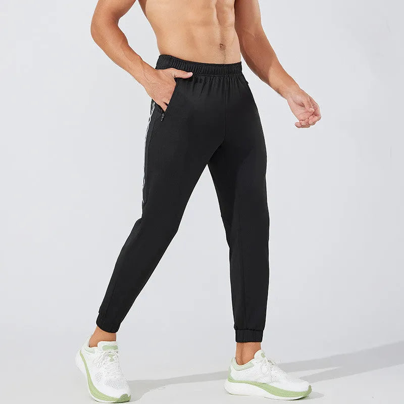 Men's black polyester running trousers with a mid waist design for exercise