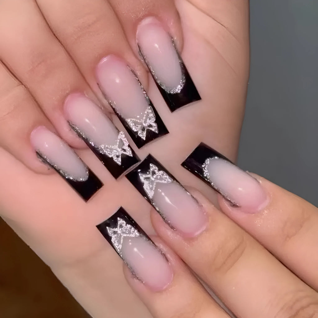 Black French style false nails with glittering butterfly pattern in medium length