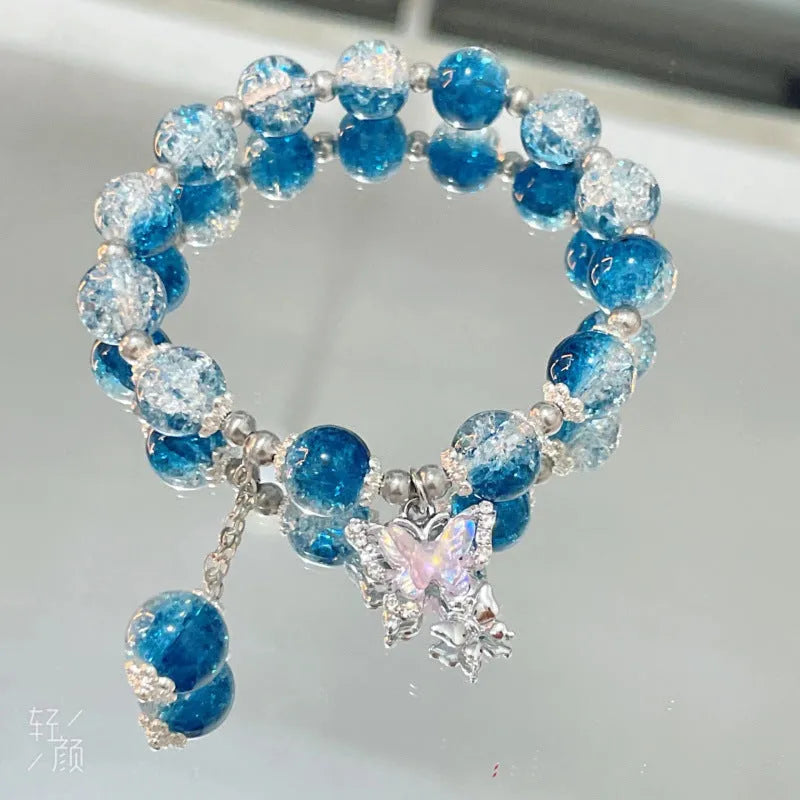 Chinese style handmade glass bead bracelet with bamboo joint elements on a white background.
