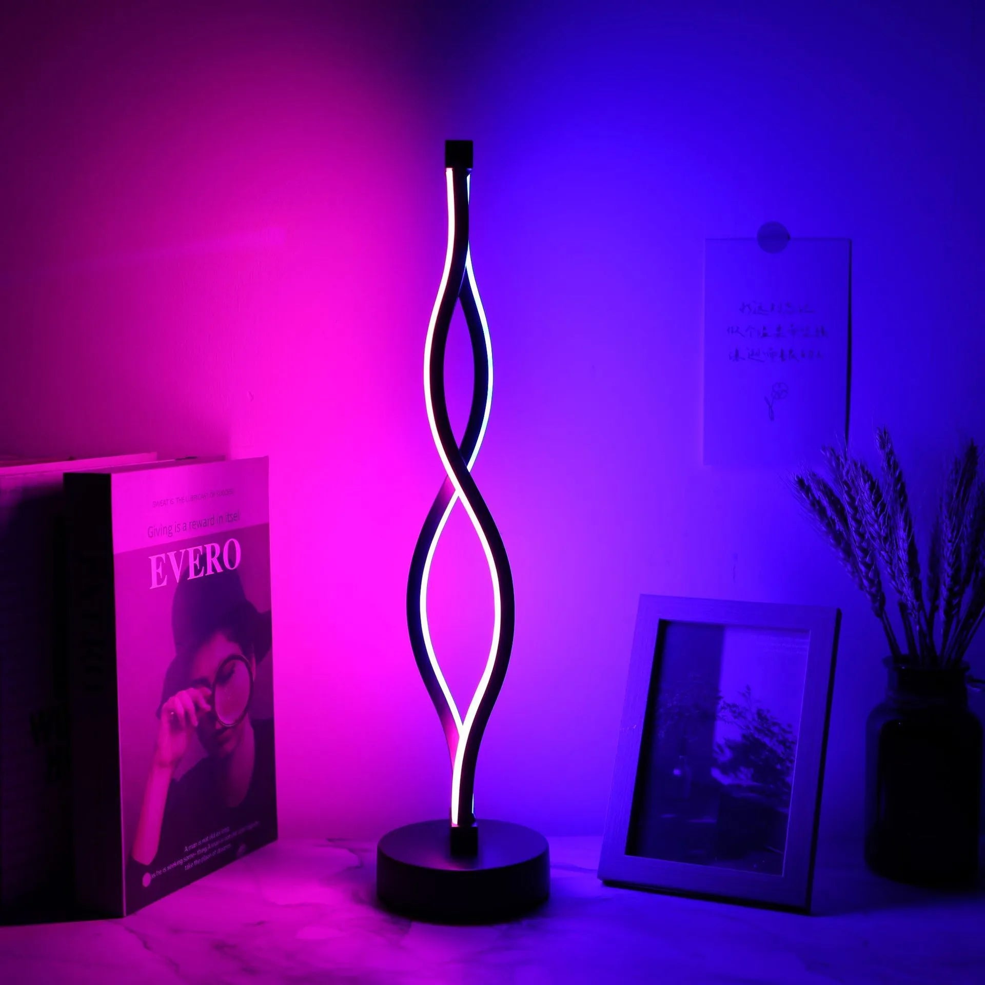 Black aluminium desk lamp with three-colour dimming button and touch-sensitive blue pink areas
