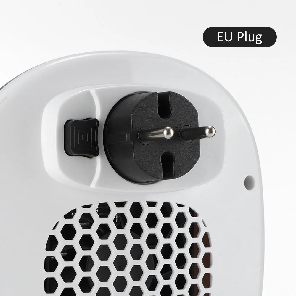 White ceramic heating electric hot air blower heater with remote control on a desk