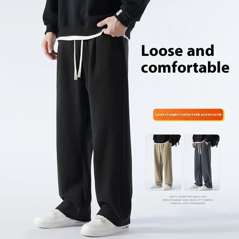 Men's apricot coloured fleece-lined loose fit sports trousers with an elasticated drawstring waist.