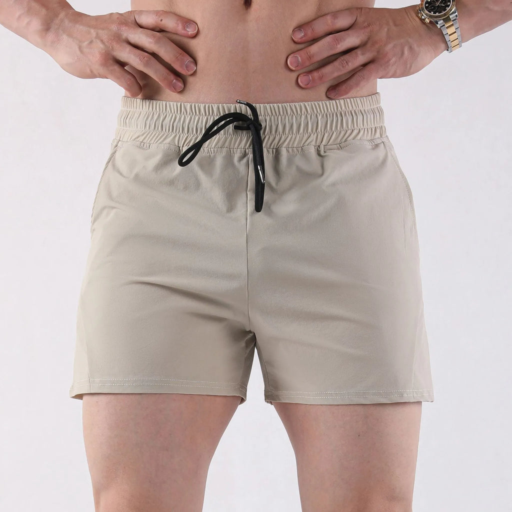 Men's thin gray polyester basketball shorts with elastic waistband for summer sports.