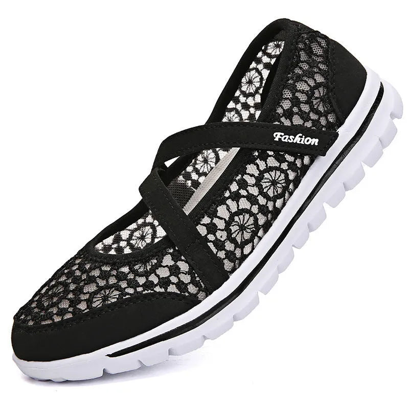 Women's beige lace-up casual flat shoes with mesh upper and round toe.