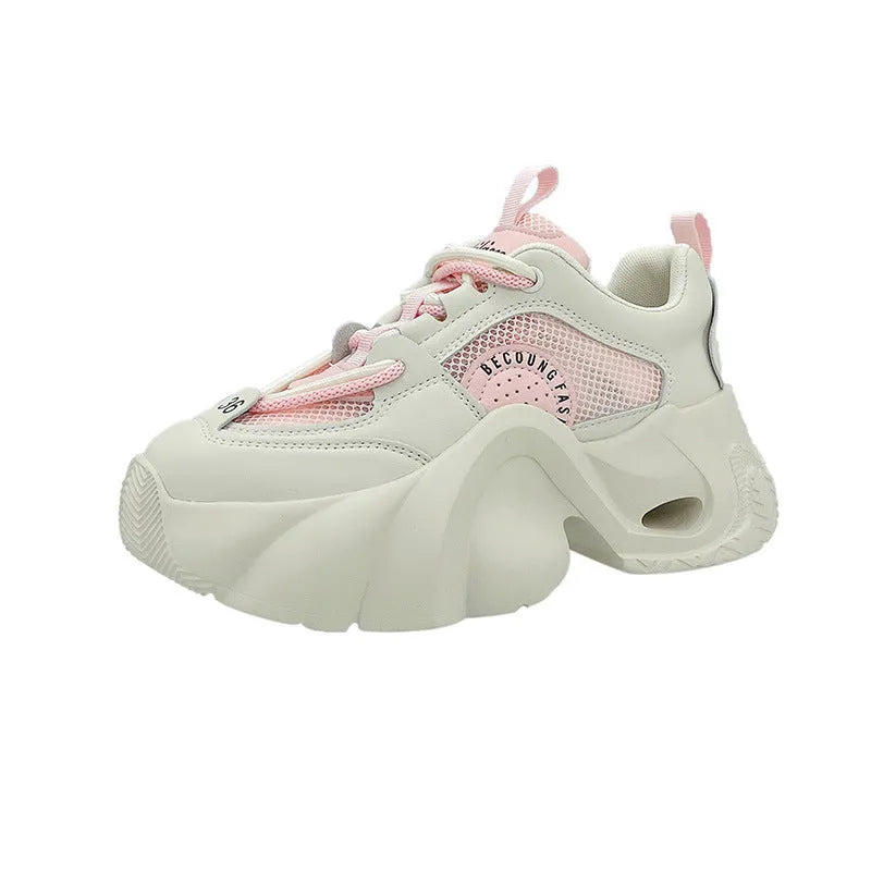 Women's pink casual sneakers with cross shoulder straps and a thick mid-heel sole.