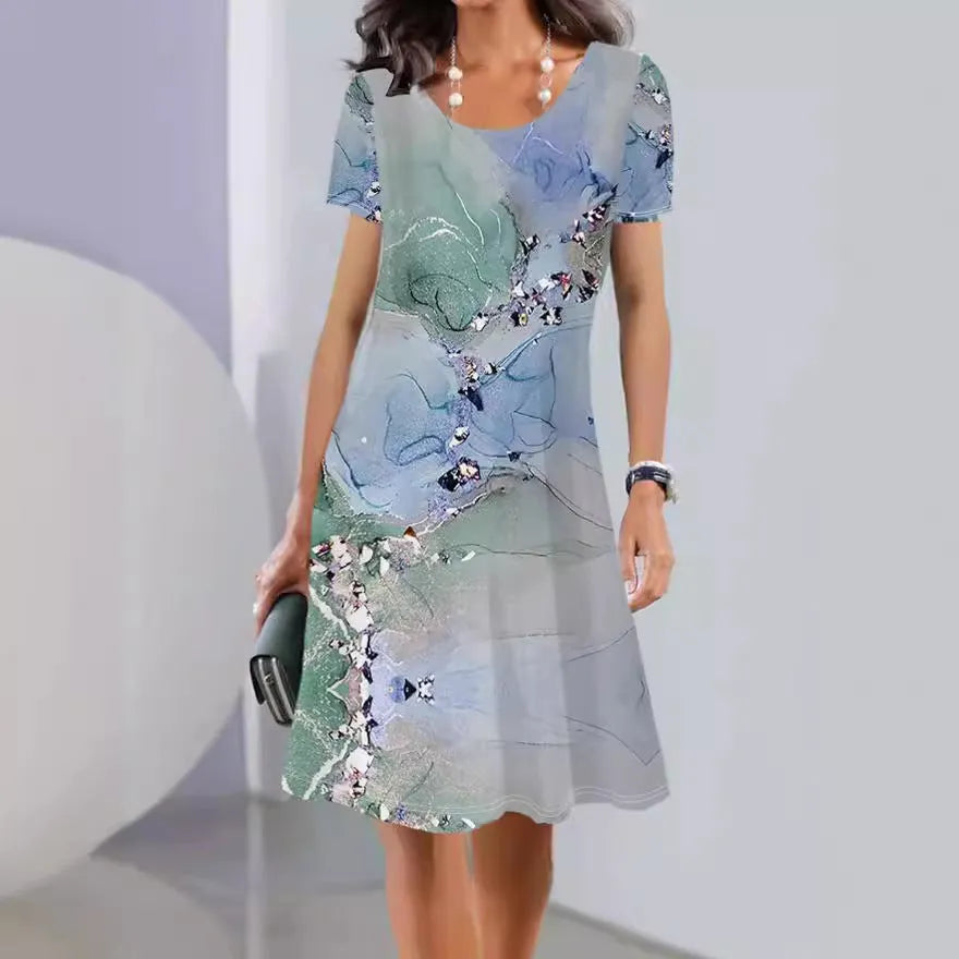 Light blue floral print summer dress with short sleeves and an A-line mid-length skirt on a hanger