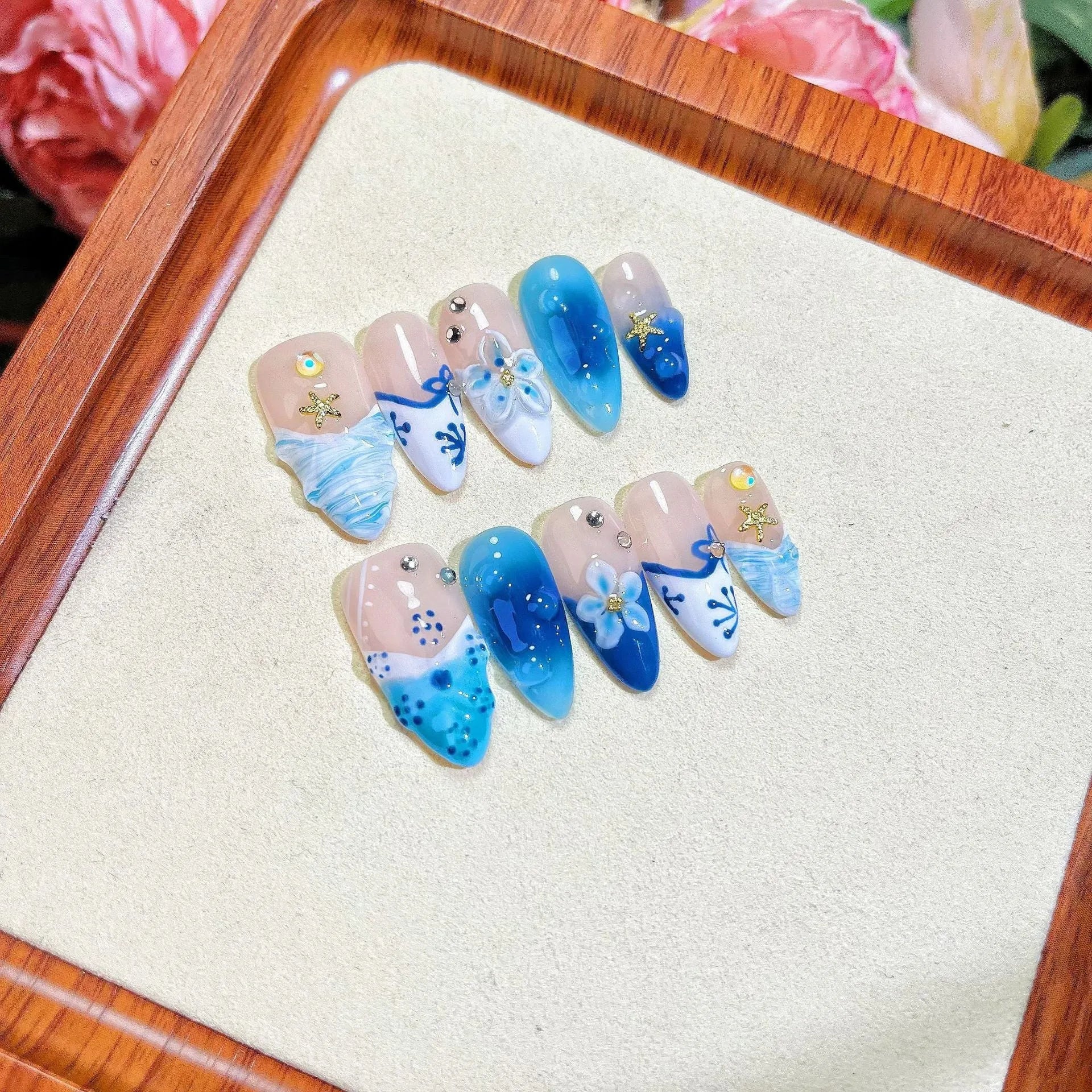 Blue hand-painted carved summer ice transparent plastic fake nails in four sizes XS S M L