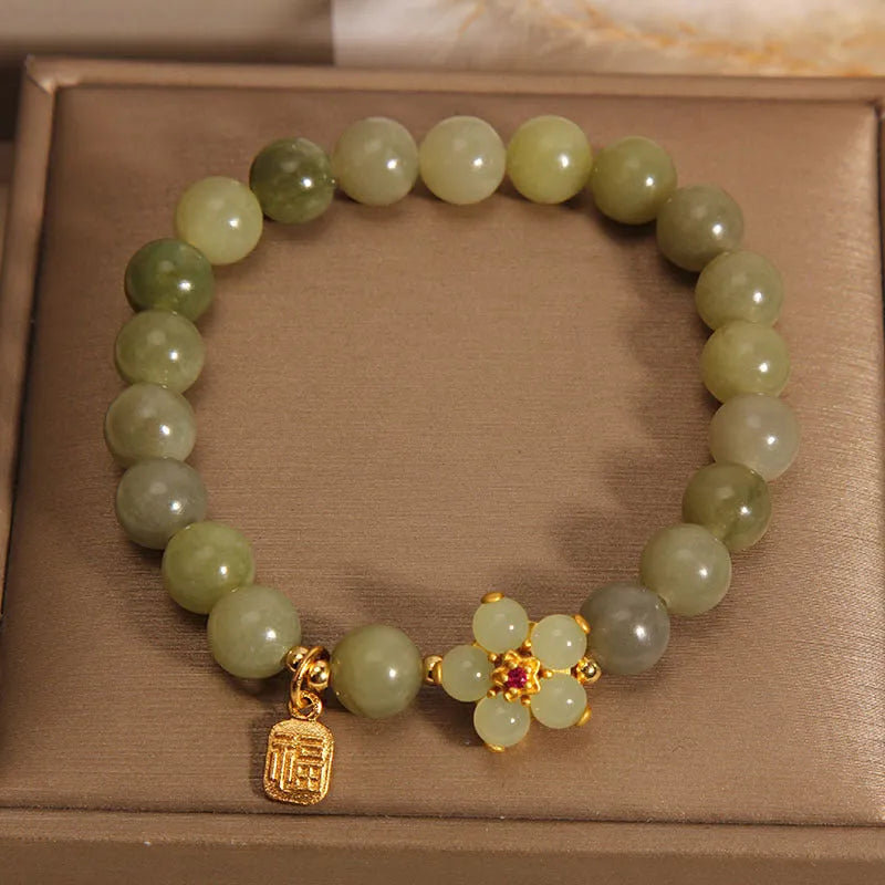 A grey jade coloured alloy bracelet with a casual style for women.