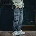 Men's blue loose straight leg stretch jeans with zip fly opening in casual retro style