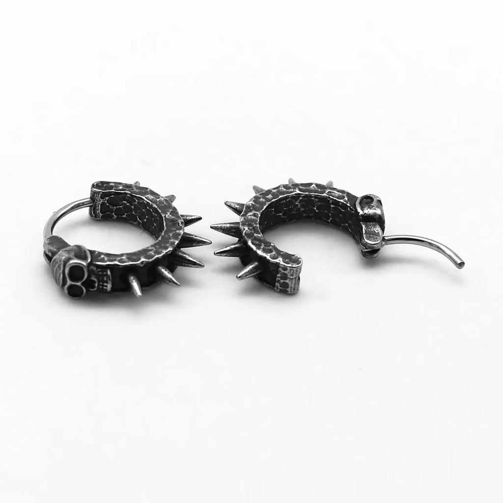 A pair of black geometric alloy earrings with copper plastic punk motorcycle detailing.