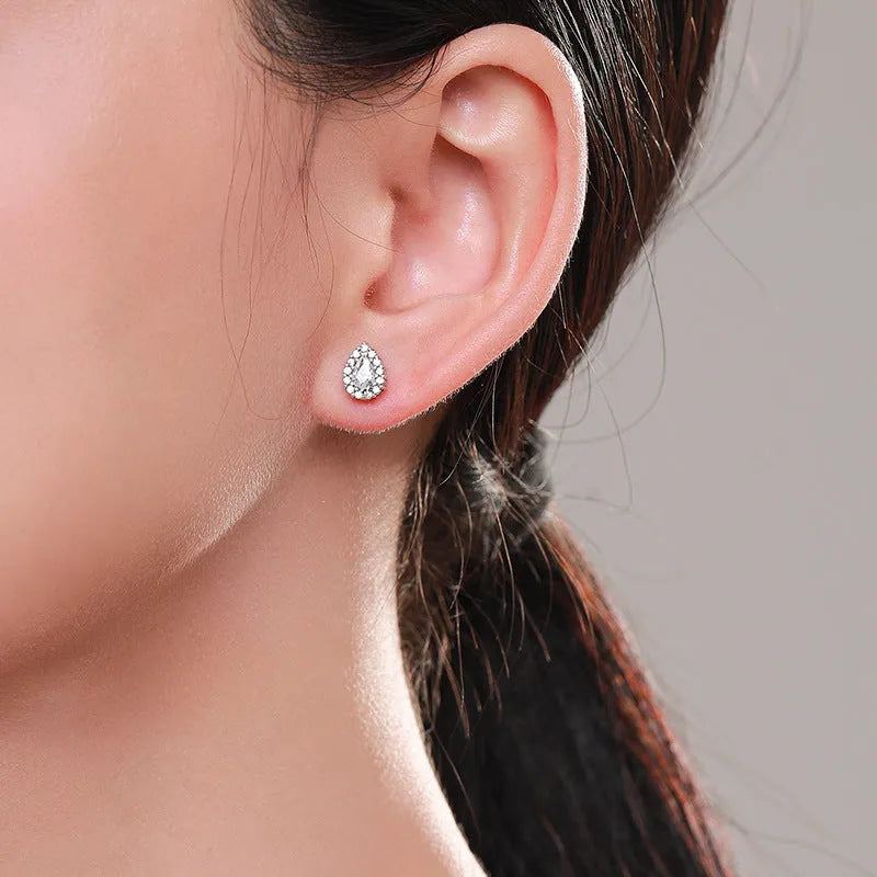 Women's silver water drop stud earrings crafted from 925 sterling silver with diamond treatment