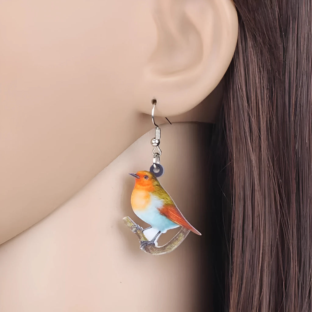 Blue titmouse pendant earrings printed on clear acrylic with animal geometry and snake design elements