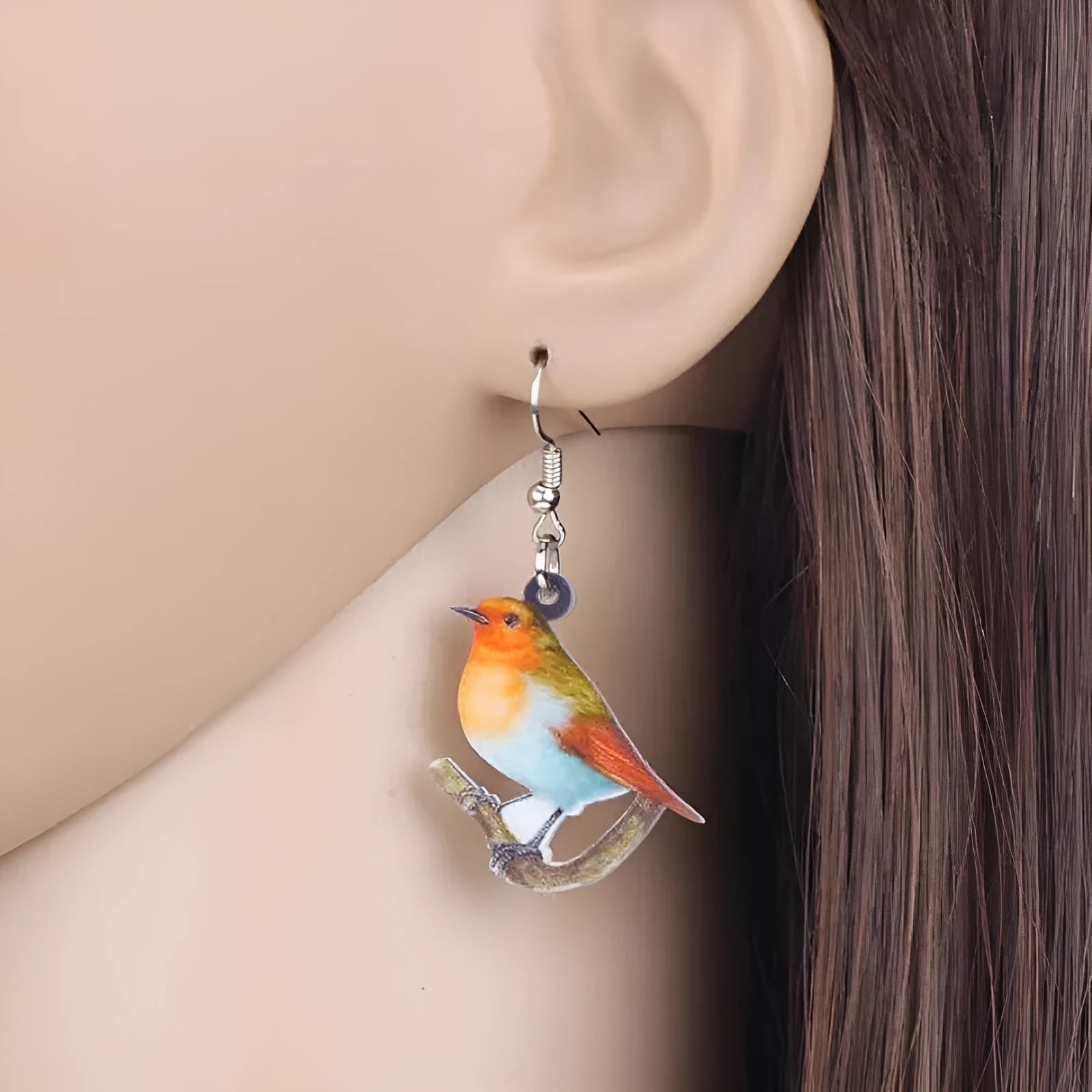 Blue titmouse pendant earrings printed on clear acrylic with animal geometry and snake design elements