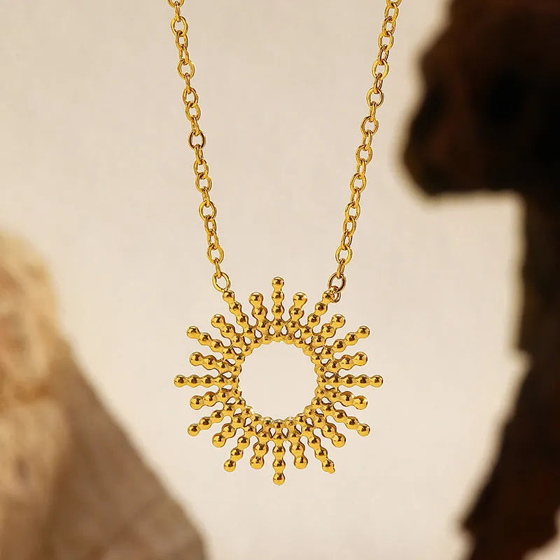 Gold sunflower bracelet and necklace set with geometric chain design