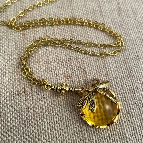 Yellow vintage bronze dragonfly pendant necklace on adjustable silver chain