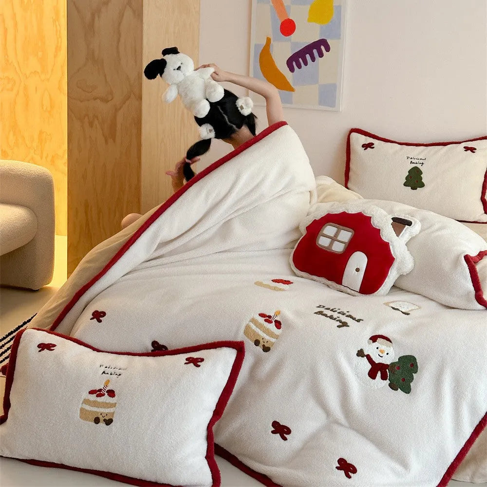 Snowman Milk Pastry cartoon print bedding four-piece set including sheet, duvet cover, and pillowcases on a bed.