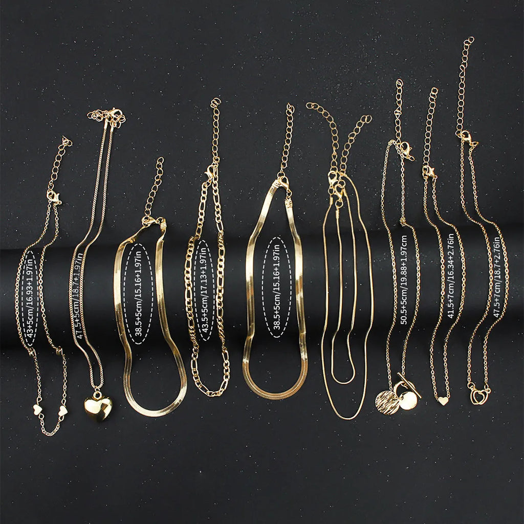 Set of 10 gold electroplated women's necklaces with snake bones chains and alloy pendants