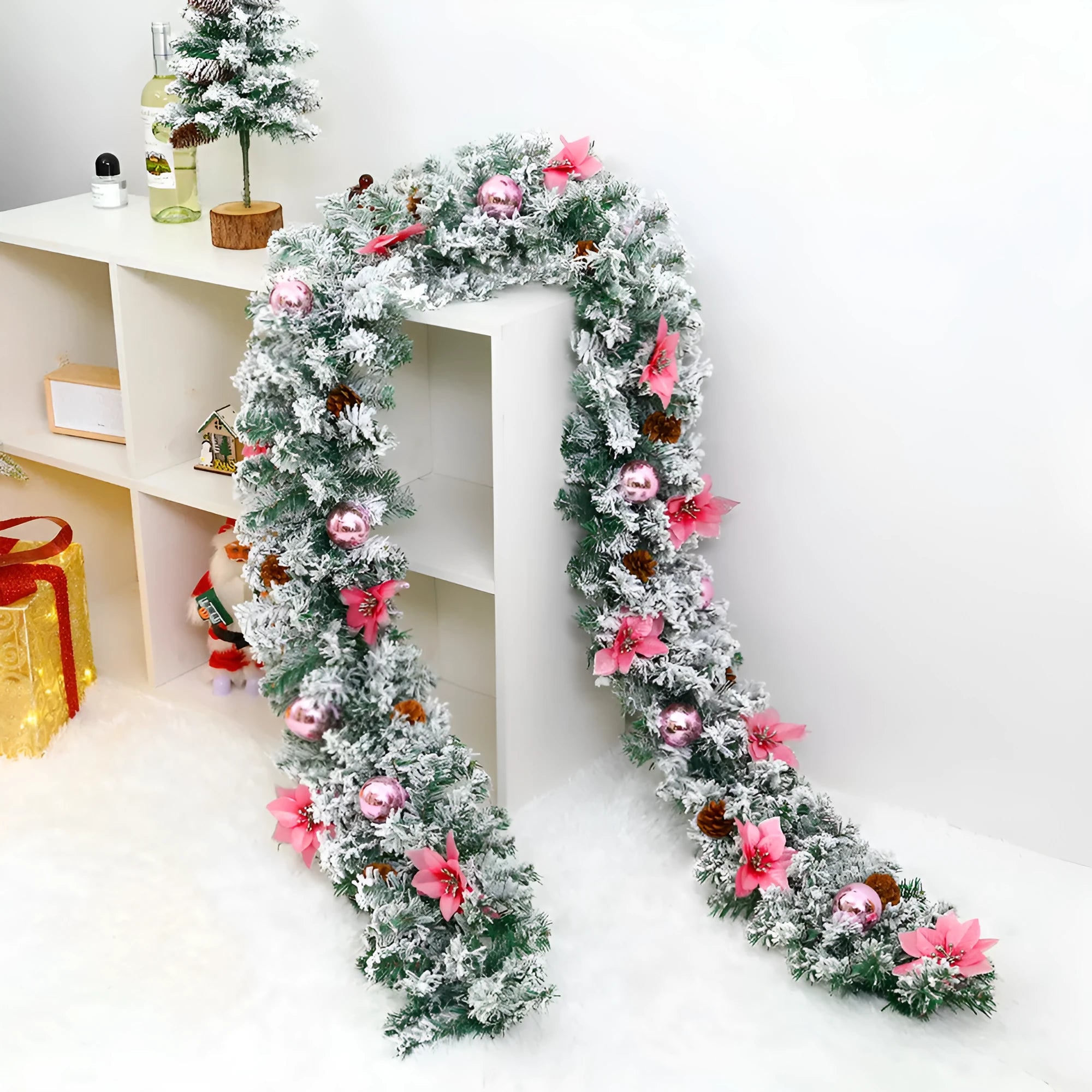Flocked PVC rattan vine Christmas garland decoration in a festive colour, draped over a mantelpiece.