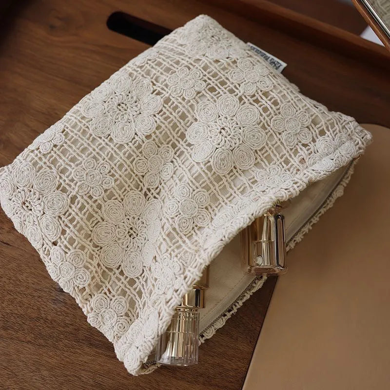 Handmade crocheted corduroy cosmetic bag with hollow flower pattern and ethnic embroidery details