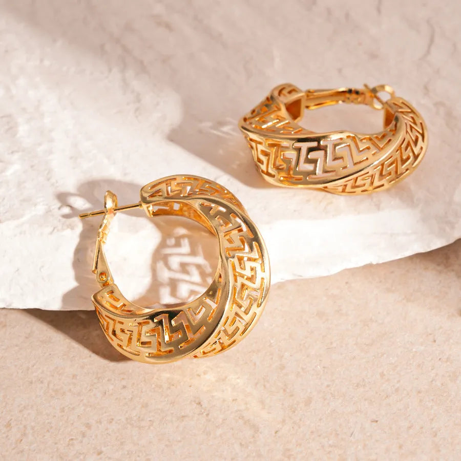 Geometric hollow stud earrings with twisted round design in silver needle-gold or silver needle-silver finish