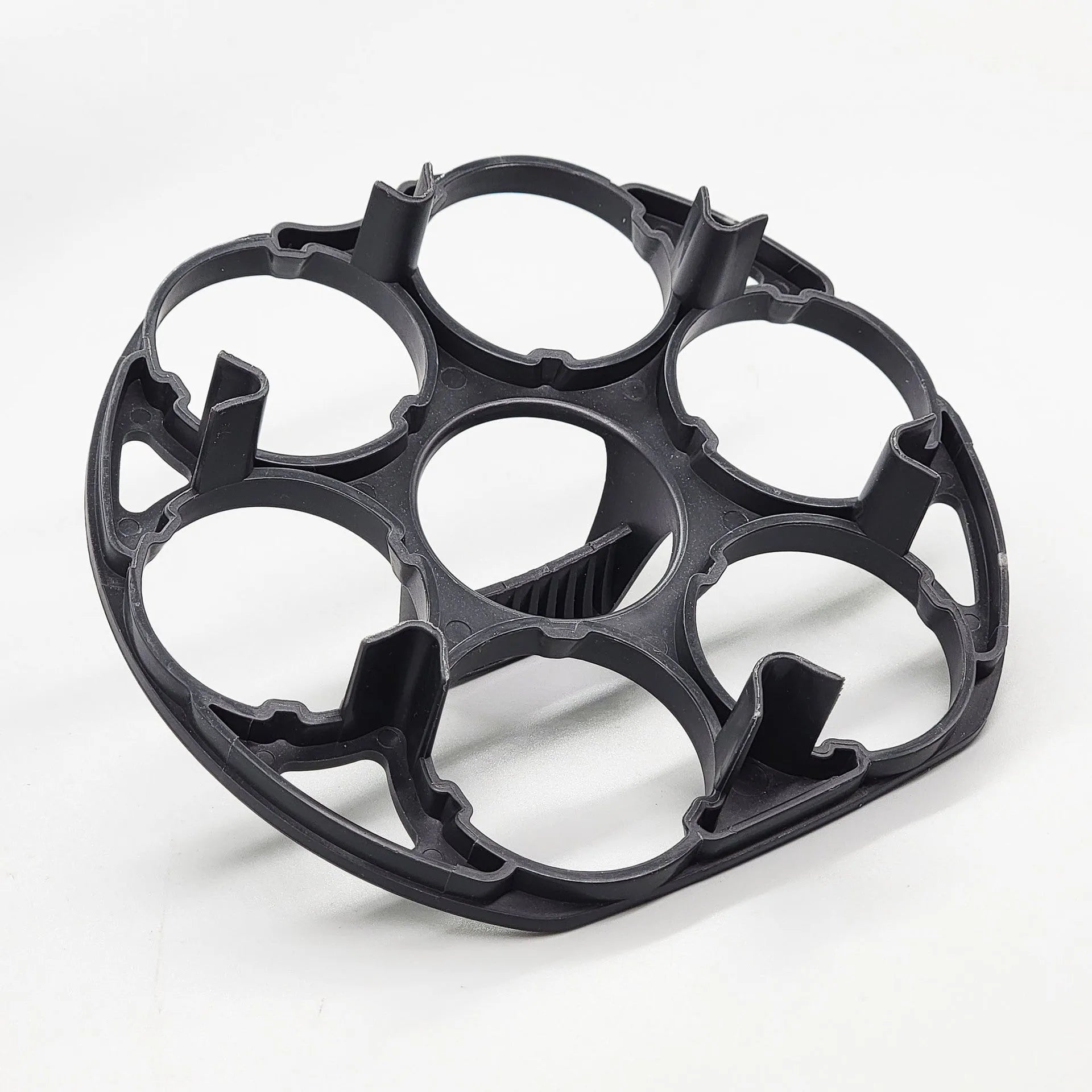 Black plastic egg holder basket measuring 13.8 by 12.6 by 5.7 centimetres