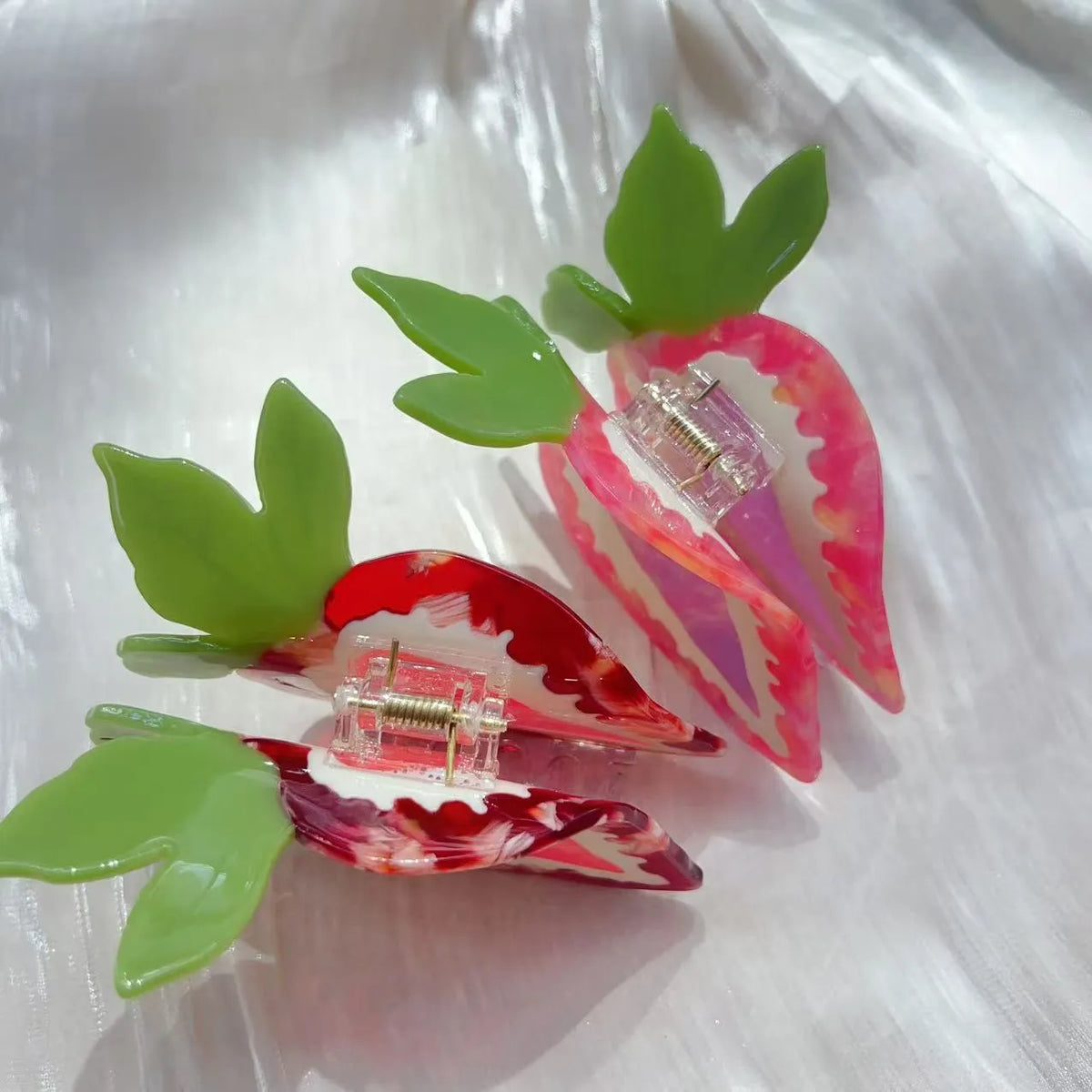 Red strawberry hairpin with manual craftsmanship on a white background