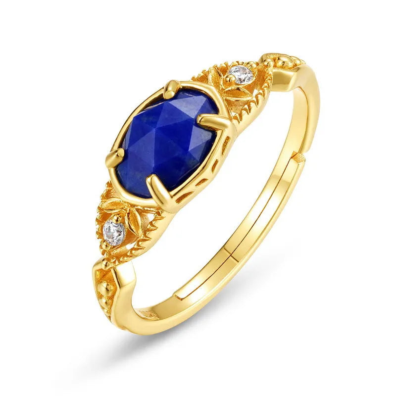 Japanese style geometric ellipse silver alloy ring for women in a lapis lazuli forest night sky colour.