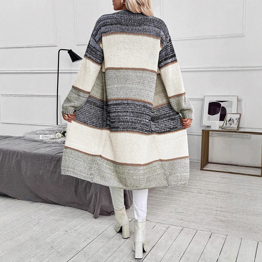 Women's grey knitted long cardigan with loose fit and stripe plaid pattern on hanger