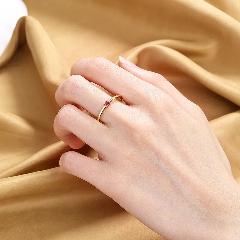 Women's geometric copper circle ring with single diamond in white, red, green, or blue colours