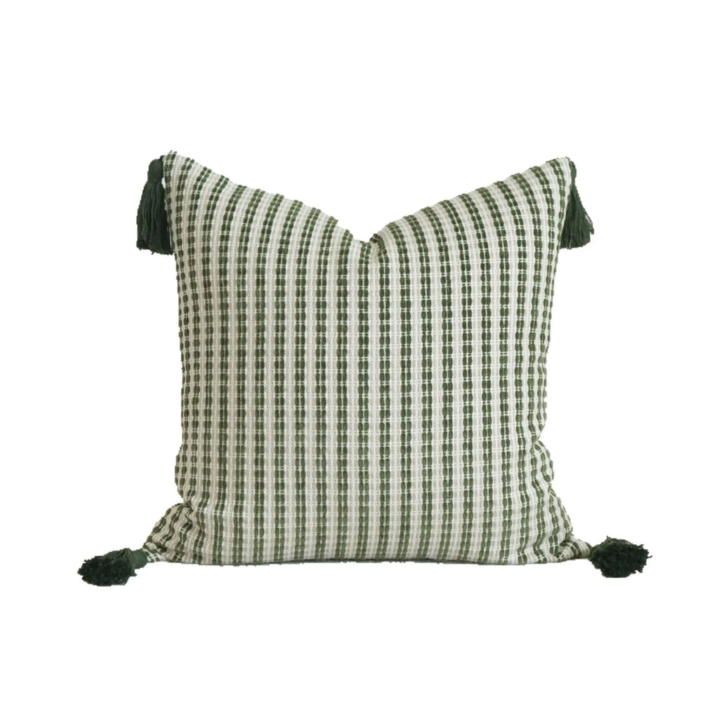 Green decorative pillow with botanical embroidery on cotton linen fabric, shown with tassel and bead details.