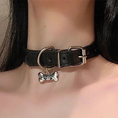 Black adjustable dog collar with a bell charm, shown in LD leather, cute bone, and cute cat paw designs.
