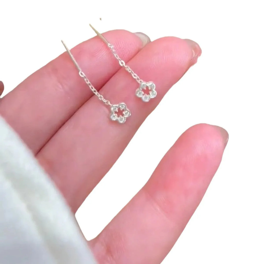 Sterling silver colour hollow flower hanging earrings with petal design