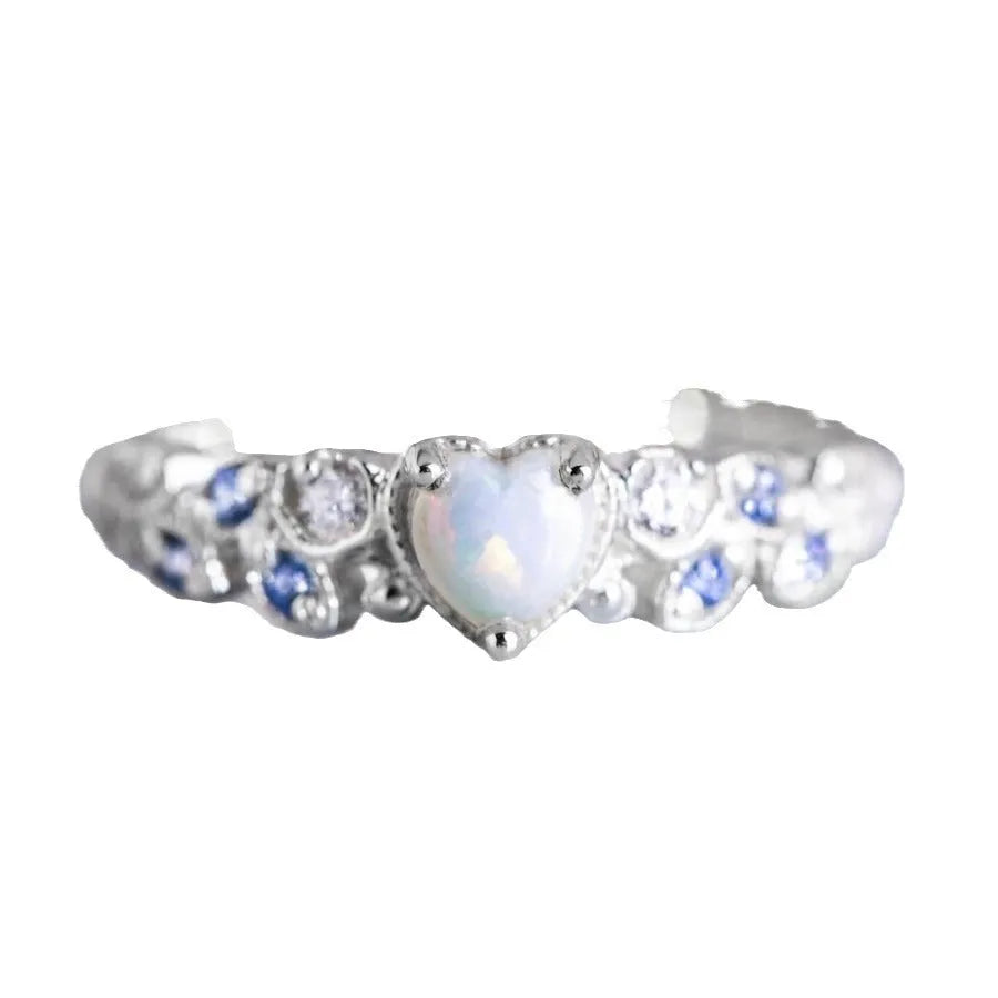 White gold tone women's heart-shaped ring with floral and oceanic pattern detailing
