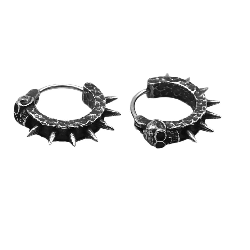 A pair of black geometric alloy earrings with copper plastic punk motorcycle detailing.