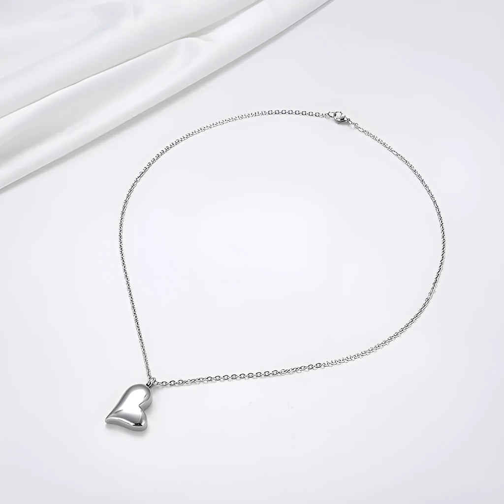 Silver tone curved peach heart stainless steel pendant necklace with adjustable chain