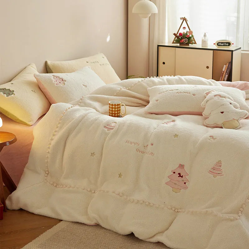 Winter milk fibre four-piece bedding set with green or pink Christmas tree pattern on a bed
