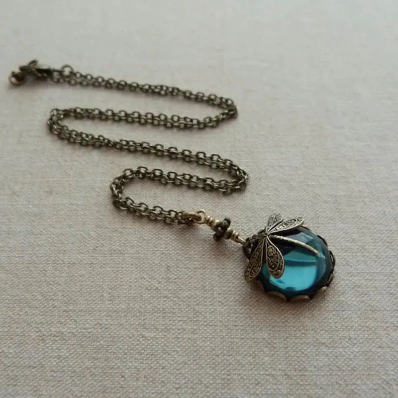 Yellow vintage bronze dragonfly pendant necklace on adjustable silver chain