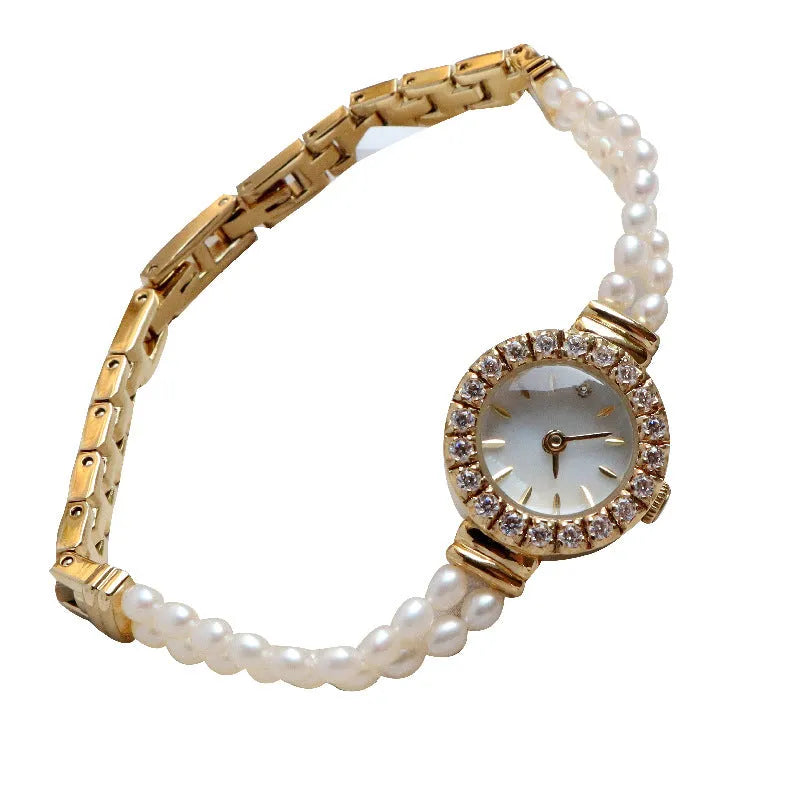 Women's light gold bracelet watch with freshwater pearls and round mineral glass dial