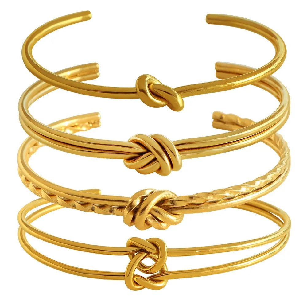 Women's adjustable stainless steel bracelet with knotted C-shaped design and 18K gold plating