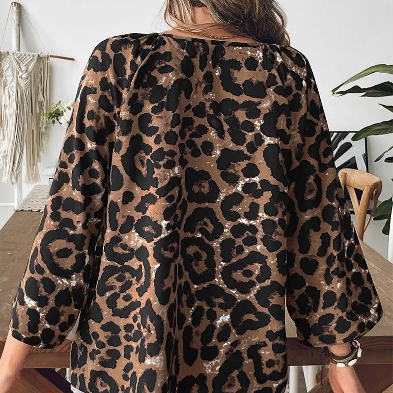Women's multicolor leopard print V-neck polyester pullover top with half sleeves.