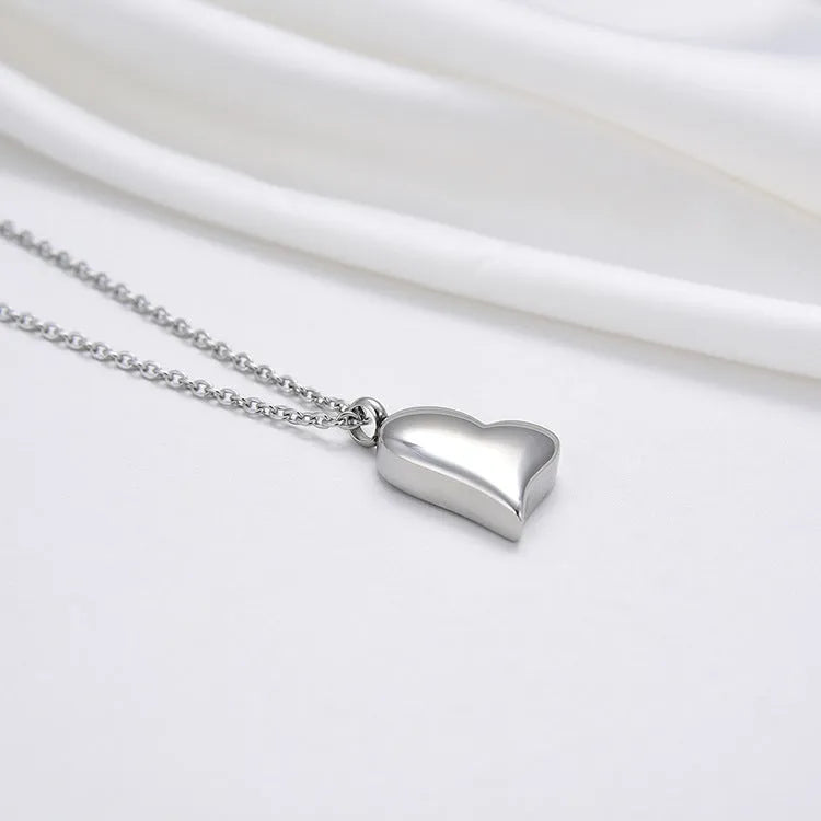 Silver tone curved peach heart stainless steel pendant necklace with adjustable chain