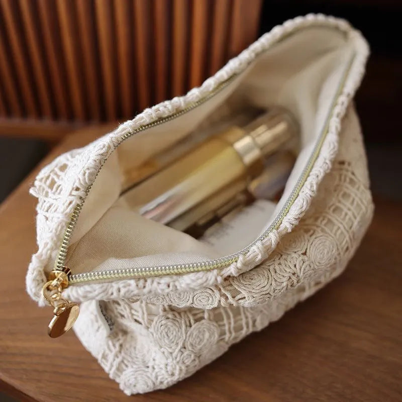 Handmade crocheted corduroy cosmetic bag with hollow flower pattern and ethnic embroidery details