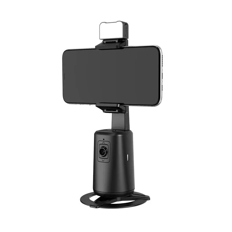 Black desktop mobile phone holder with ribbon lights and remote control for face tracking.