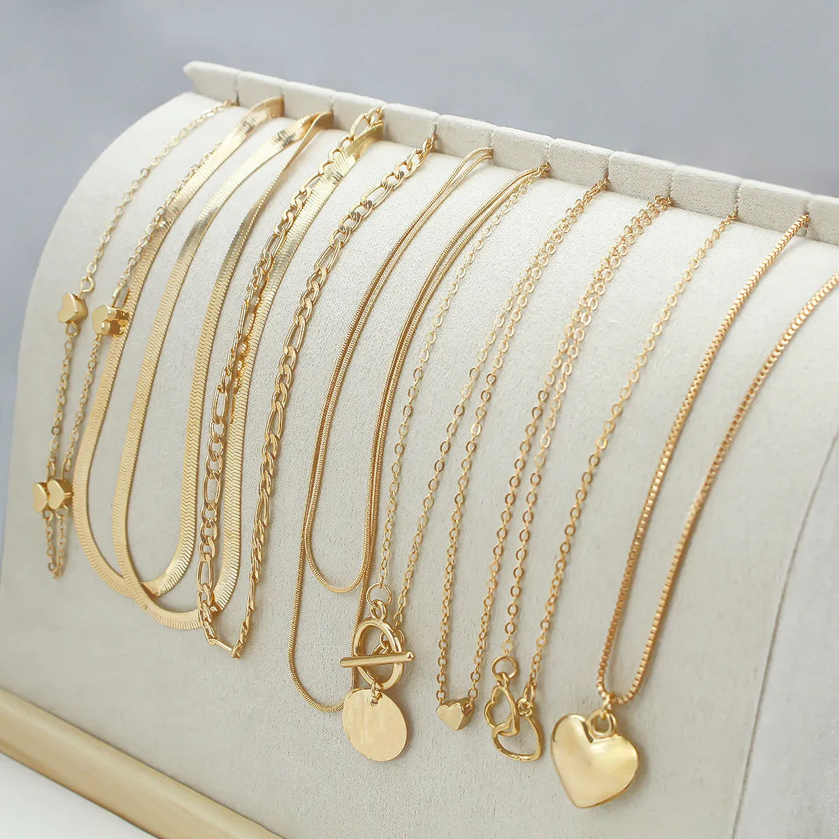 Set of 10 gold electroplated women's necklaces with snake bones chains and alloy pendants