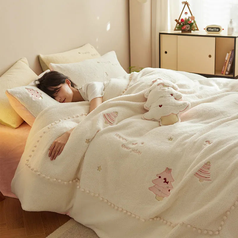 Winter milk fibre four-piece bedding set with green or pink Christmas tree pattern on a bed